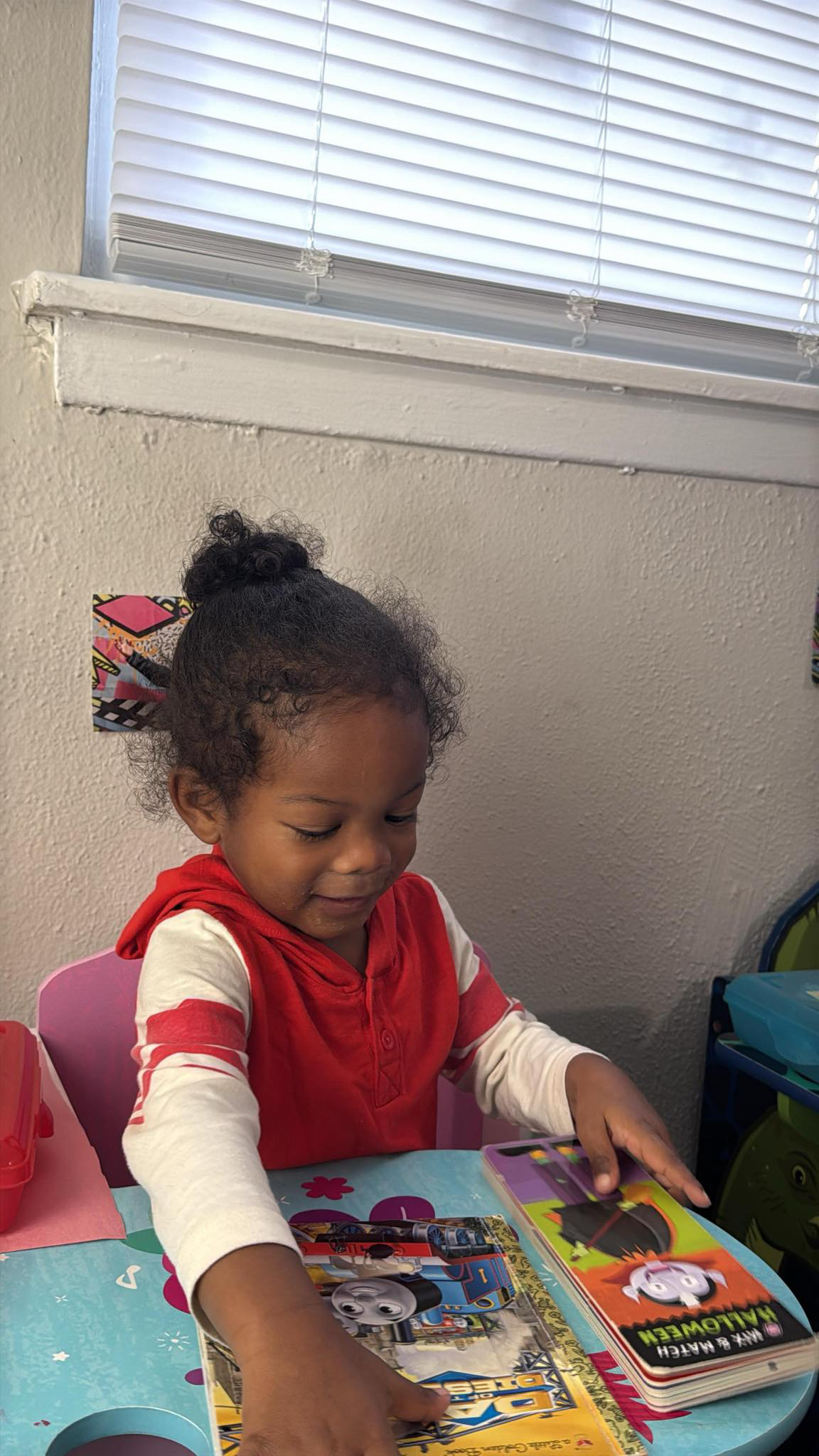 Child reading at Your Big Cissy Daycare