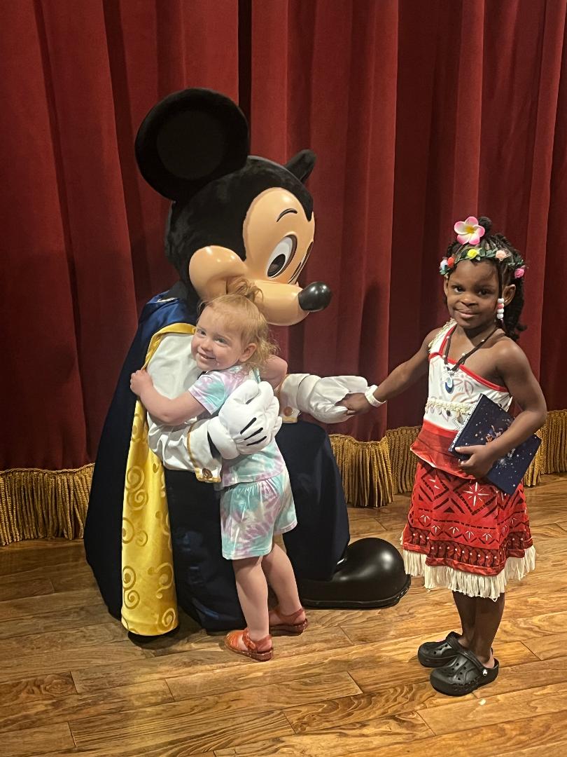 Kids with Mickey Mouse at a special event